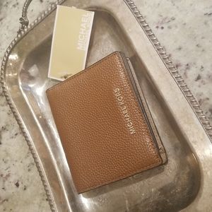 Michael Kors tan leather carryall card case.